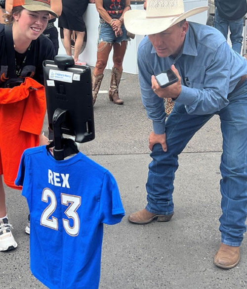 Ethan using the Rex Robot to experience Outlaw Days, and talk to Coach Hart!