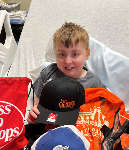 Ethan showing off his Kansas City Outlaws Merch!